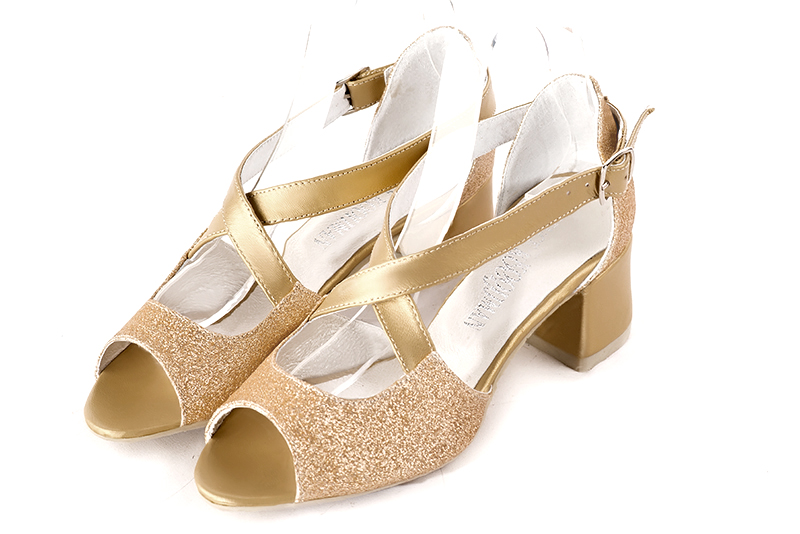 Gold women's closed back sandals, with crossed straps. Round toe. Low flare heels. Front view - Florence KOOIJMAN